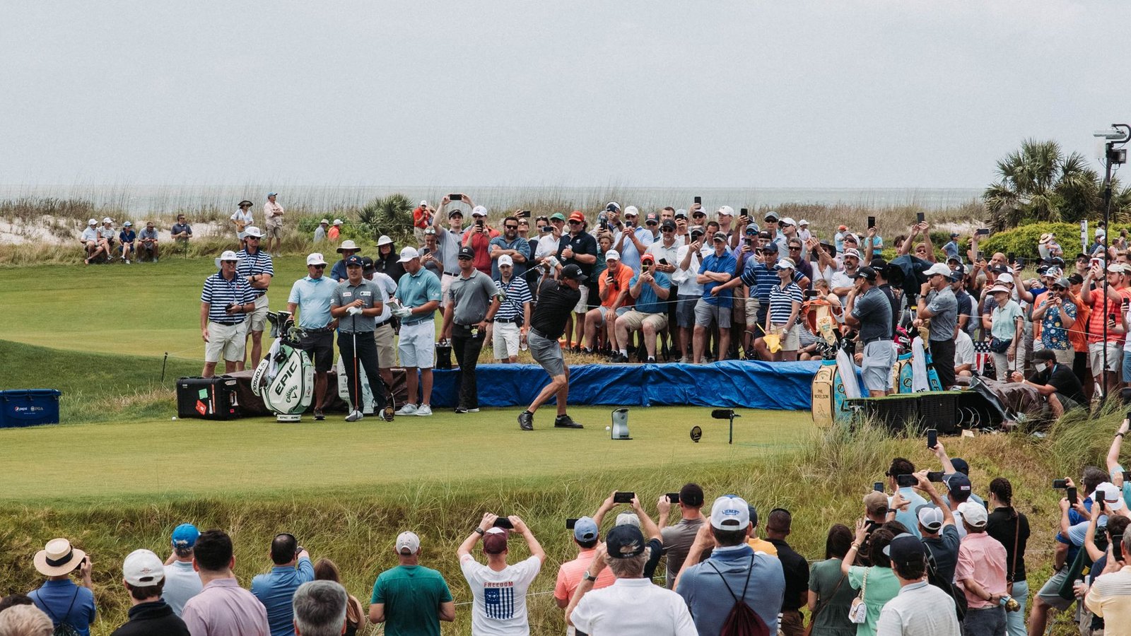People standing on a green golf course