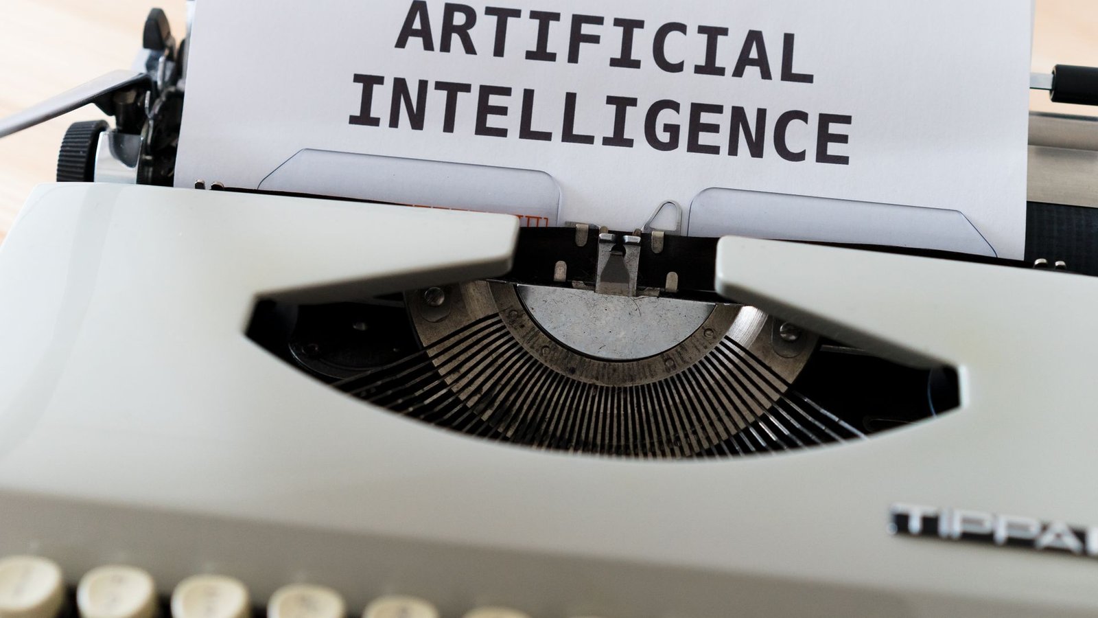 Vintage typewriter with the words artificial intelligence typed on a sheet of paper