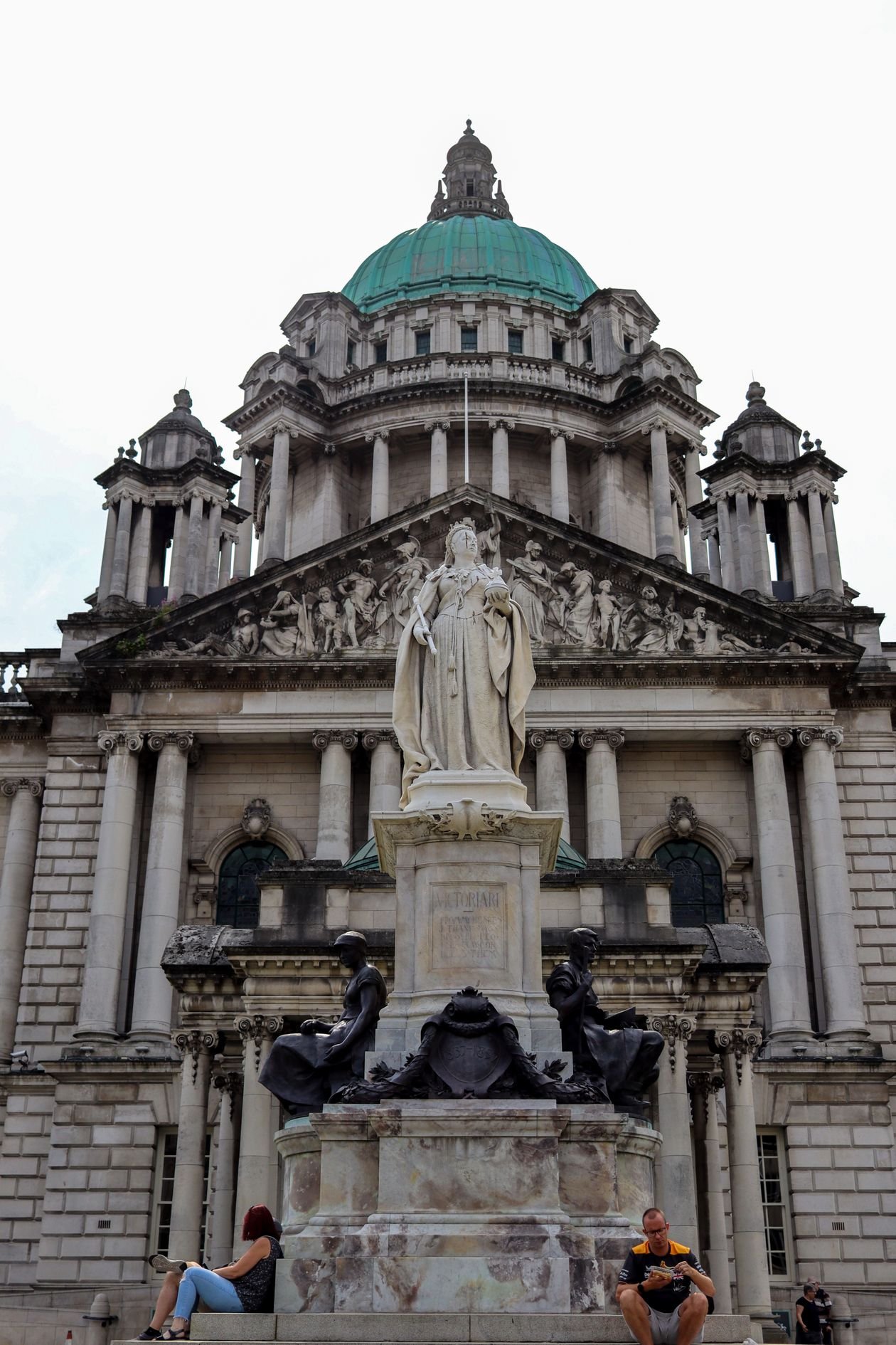 Front view of Belfast City Hall with its dome and statue.